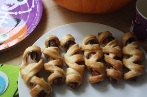 halloween pastry wrapped mummy sausages